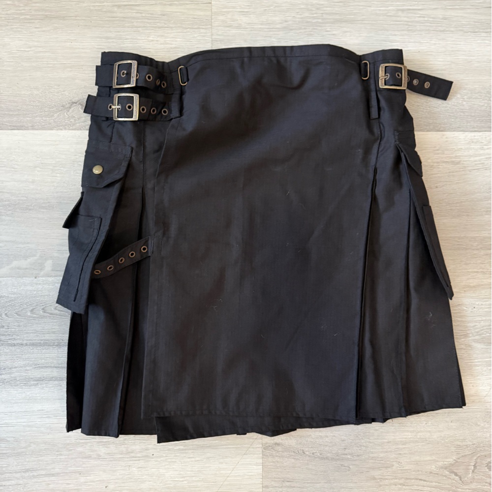 Got Kilt? Branded black kilt with buckles and pockets